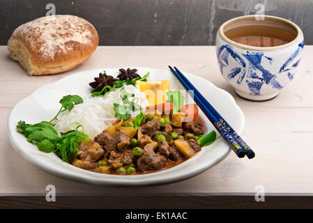 Bo Kho - traditional Vietnamese beef stew, a favorite meaty breakfast dish with lots of spices, mainly star anise, lemongrass, Stock Photo