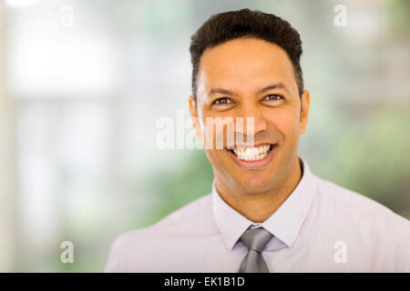 close up portrait of handsome mid age businessman indoors Stock Photo