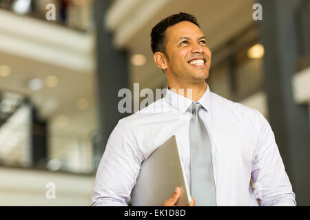 good looking middle aged entrepreneur in office building Stock Photo