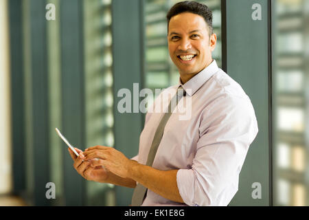 smiling middle aged businessman using smart phone Stock Photo