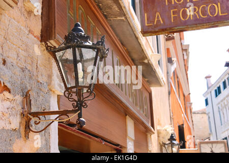 VENICE, ITALY - MAY 06, 2014: Lantern on the facade of the hotel in Venice, Italy Stock Photo