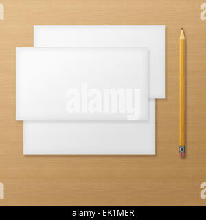 Set of blank envelopes with yellow pencil on wooden background. With soft shadows. Stock Photo