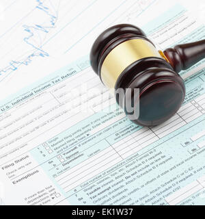 Judge's gavel over 1040 US Tax form - close up shot Stock Photo