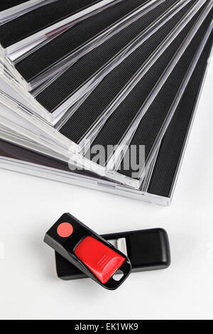 Two USB Flashdrives and a stack of DVD's Stock Photo