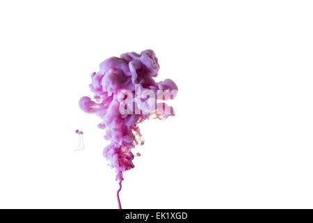violet colored ink creating smoke patterns in water Stock Photo
