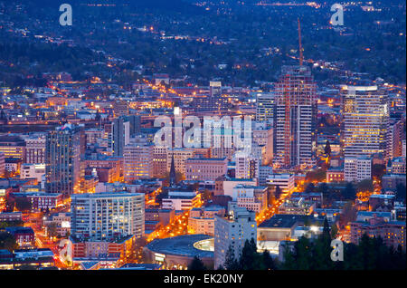 Downtown Portland Oregon city lights blue hour. Stock Photo