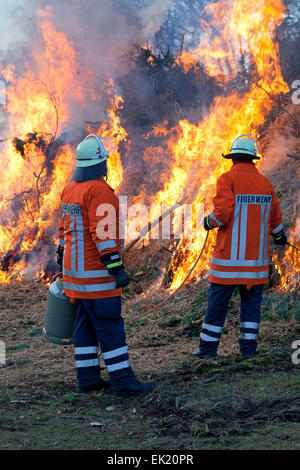 firemen lighting Easter eve bonfire, Neetze, Lower Saxony, Germany Stock Photo