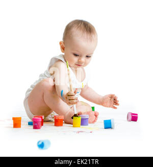 baby painting by paintbrush - on white background Stock Photo