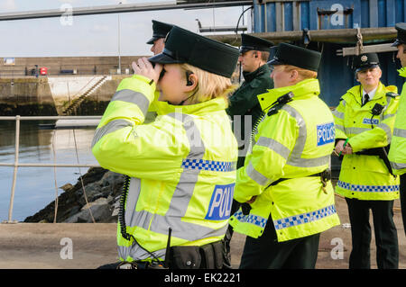 Bangor, County Down. 23/09/2012 - PSNI officers look out to sea using binoculars during a major rescue operation Stock Photo