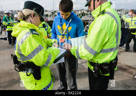 Bangor, County Down. 23/09/2012 - PSNI officers write down the name of a young man involved in a major rescue operation Stock Photo