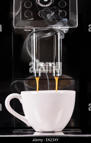 Detail of coffee machine making espresso Stock Photo