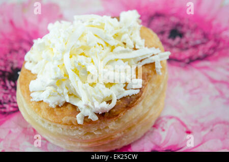 Home baked puff pastry with cheese on decorated plate Stock Photo