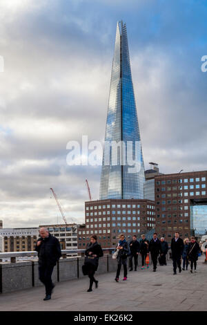 People Crossing London Bridge On Their Way To Work In The City of London, London, England