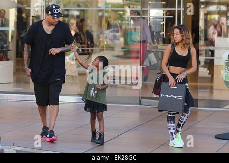 Chris Brown seen with girlfriend Karrueche Tran and friends at The Grove. They lunched at La Piazza Ristorante then headed for Nordstrom's to shop before returning to Valet before leaving. Featuring: Chris Brown,Karrueche Tran Where: Los Angeles, Californ Stock Photo