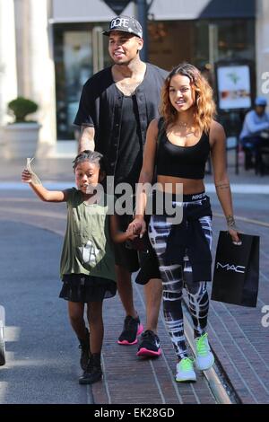 Chris Brown seen with girlfriend Karrueche Tran and friends at The Grove. They lunched at La Piazza Ristorante then headed for Nordstrom's to shop before returning to Valet before leaving. Featuring: Chris Brown,Karrueche Tran Where: Los Angeles, Californ Stock Photo