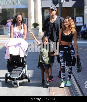 Chris Brown seen with girlfriend Karrueche Tran and friends at The Grove. They lunched at La Piazza Ristorante then headed for Nordstrom's to shop before returning to Valet before leaving. Featuring: Chris Brown,Karrueche Tran Where: Los Angeles, Californ Stock Photo