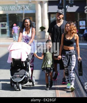 Chris Brown seen with girlfriend Karrueche Tran and friends at The Grove. They lunched at La Piazza Ristorante then headed for Nordstrom's to shop before returning to Valet before leaving. Featuring: Chris Brown,Karrueche Tran Where: Los Angeles, Californ Stock Photo