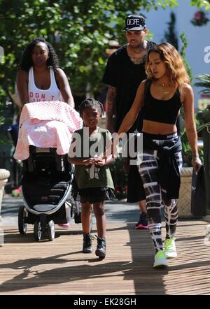 Chris Brown seen with girlfriend Karrueche Tran and friends at The Grove. They lunched at La Piazza Ristorante then headed for Nordstrom's to shop before returning to Valet before leaving. Featuring: Chris Brown,Karrueche Tran Where: Los Angeles, Californ Stock Photo