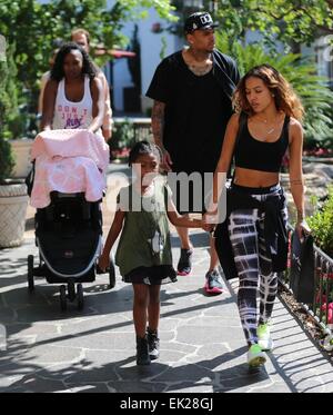 Chris Brown seen with girlfriend Karrueche Tran and friends at The Grove. They lunched at La Piazza Ristorante then headed for Nordstrom's to shop before returning to Valet before leaving. Featuring: Chris Brown,Karrueche Tran Where: Los Angeles, Californ Stock Photo