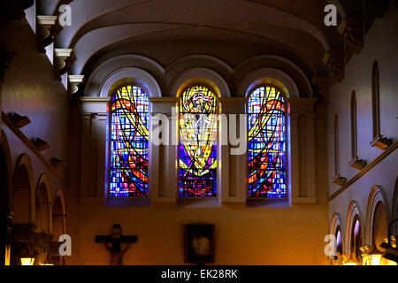 Interior of St. Teresa's Carmelite church in Clarendon street Dublin Ireland, showing the elaborate stained glass windows. Stock Photo