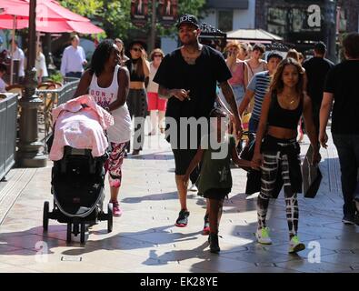 Chris Brown seen with girlfriend Karrueche Tran and friends at The Grove. They lunched at La Piazza Ristorante then headed for Nordstrom's to shop before returning to Valet before leaving. Featuring: Chris Brown,Karrueche Tran Where: Los Angeles, Californ Stock Photo