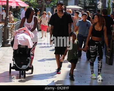 Chris Brown seen with girlfriend Karrueche Tran and friends at The Grove. They lunched at La Piazza Ristorante then headed for Nordstrom's to shop before returning to Valet before leaving. Featuring: Chris Brown,Karrueche Tran Where: Los Angeles, Californ Stock Photo