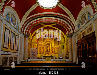 Side altar displaying the Child Jesus of Prague Icon in St. Teresa's Carmelite Church Clarendon street Dublin, Ireland Stock Photo