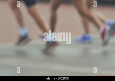 Blur, legs of three women runners running in group, people, fitness, activity, lifestyle Stock Photo