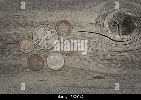 Old United States coins on rustic wood with vintage concept. Layout in horizontal format. Stock Photo