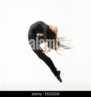 modern style dancer jumping, posing on white background Stock Photo