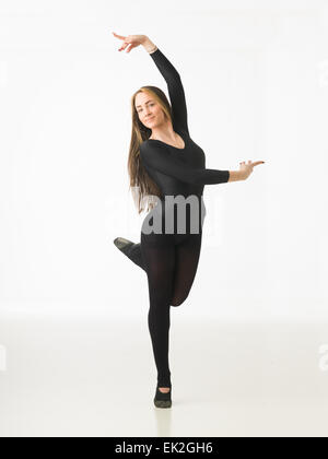 beautiful female ballet dancer posing on white background Stock Photo