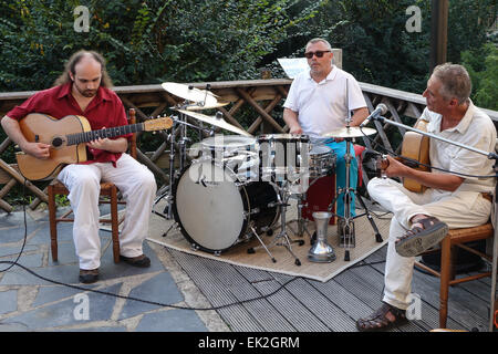 Georges Paltrié, Jean Carillo and Jack Robineau performing live jazz at Le Moulin Fort Camping, near Francueil in the Loire Stock Photo