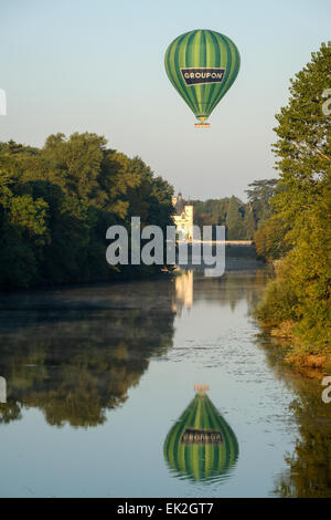 Groupon hot air balloon drifting the Chateau Chenonceau on the river Cher, France, early morning. Stock Photo