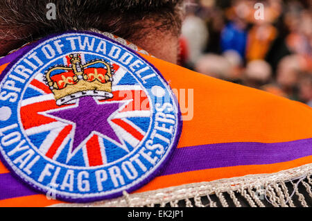 Belfast, Northern Ireland. 1st March 2014 - An Orangeman wears a sash with a badge on the back 'Spirit of Twaddell. Loyal Flag Protesters' Stock Photo