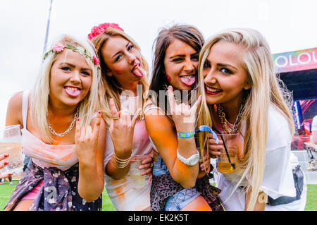 Belfast, Northern Ireland 15 August 2014 - Four young ladies enjoying themselves at the Holi One Festival of Colour Stock Photo