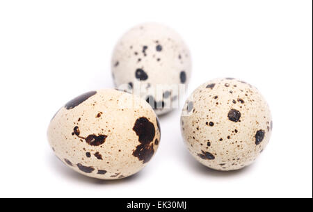 four fresh quail eggs on white background Stock Photo