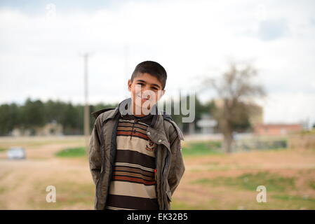 many children returning into Konbane with their parents. 3.4.2015, Kobane, Syria Stock Photo