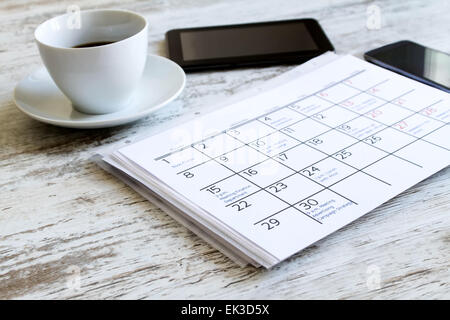 Checking monthly activities and appointments at the office Stock Photo