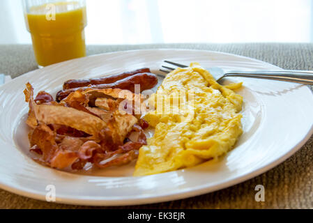 hearty eggs, bacon and sausage breakfast Stock Photo