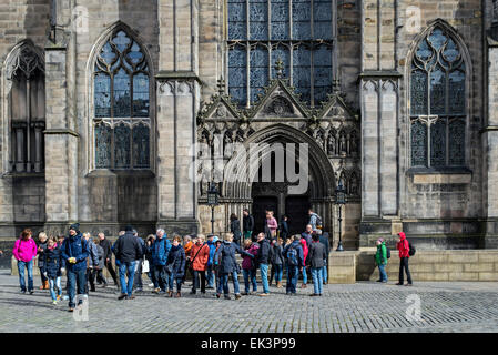 Tourists outside the main entrance to St Giles Cathedral on the Royal Mile in Edinburgh, Scotland, UK.
