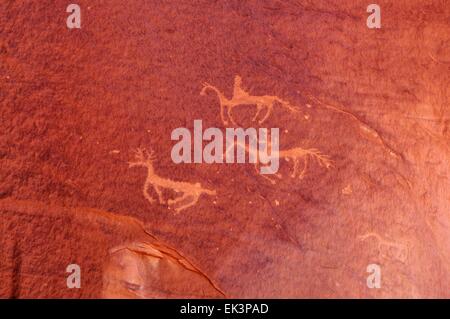 The hunt -  petroglyph on wall in Canyon De Chelly Chinle, Arizona  - USA Stock Photo