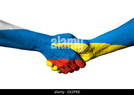 United Kingdom flag and Ukraine flag across handshake isolated on white background. Stock Photo