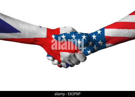 United Kingdom flag and USA flag across handshake isolated on white background. Stock Photo