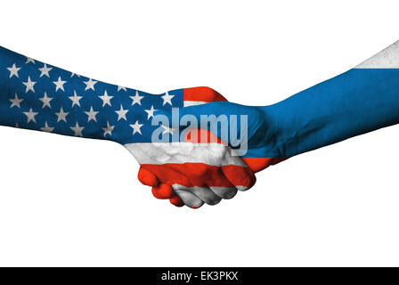 USA and Russian flag across handshake isolated on white background. Stock Photo