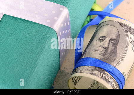 american money and green gift box Stock Photo