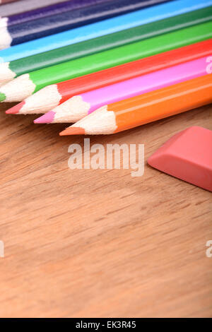 pencil set on wooden plate with eraser Stock Photo