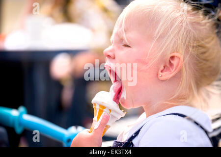 Young Girl Eating Ice Cream Stock Photo