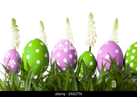 Row of Easter eggs in Fresh Green Grass Stock Photo