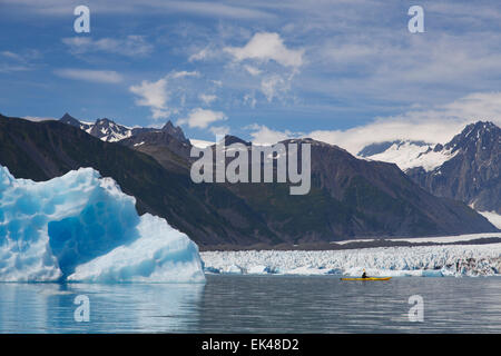 Kayaking in Bear Glacier Lagoon, Kenai Fjords National Park, near Seward, Alaska.  (model released) Stock Photo