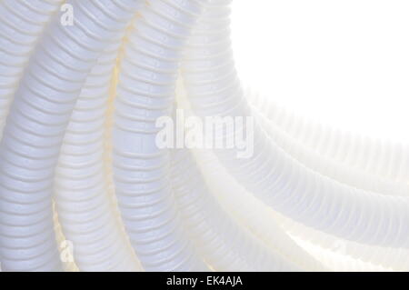 White plastic corrugated pipe isolated on white background Stock Photo